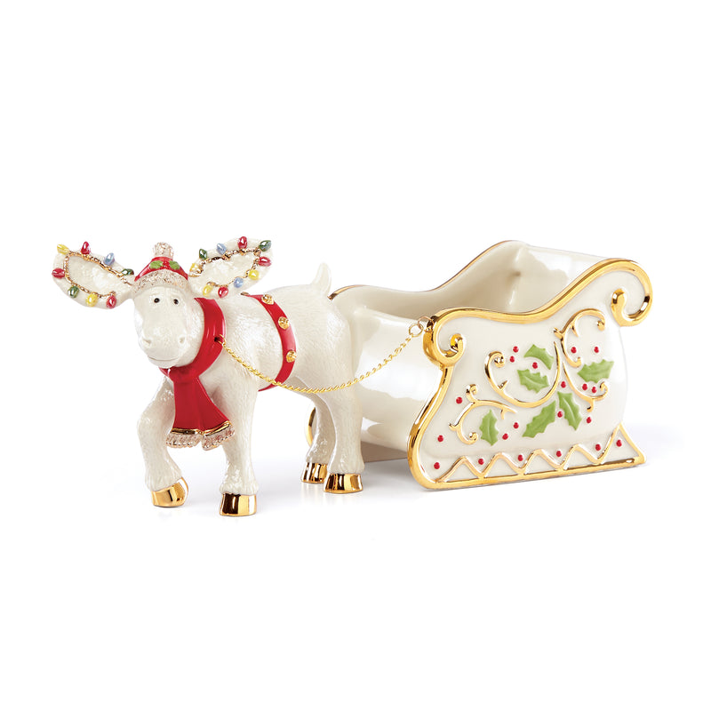 Porcelain figural candy dish with sled and white horse pulling a red-clad figure
