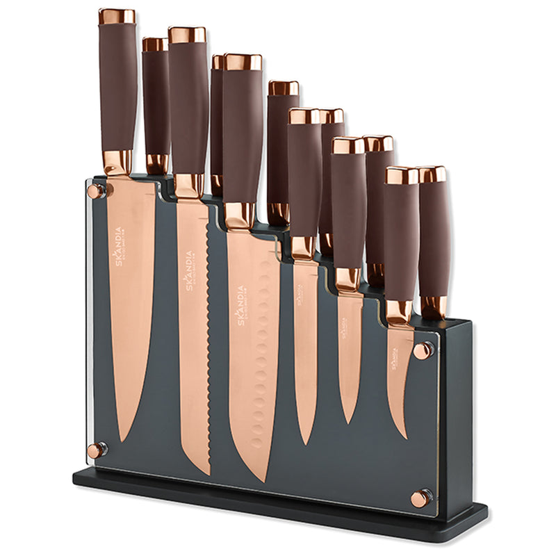 Knife block set with copper titanium-plated blades and dark handles on a black stand