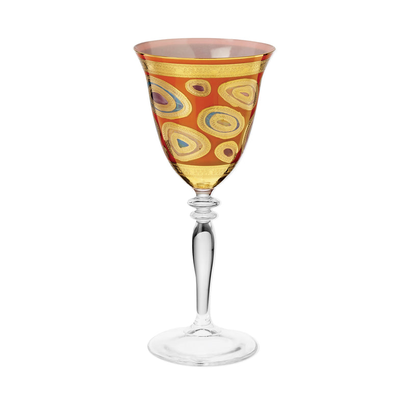 Vietri Regalia orange wine glass with swirling pattern on bowl