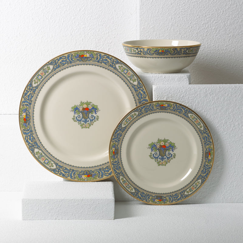 Porcelain 3-piece place setting with blue floral border and multicolor center