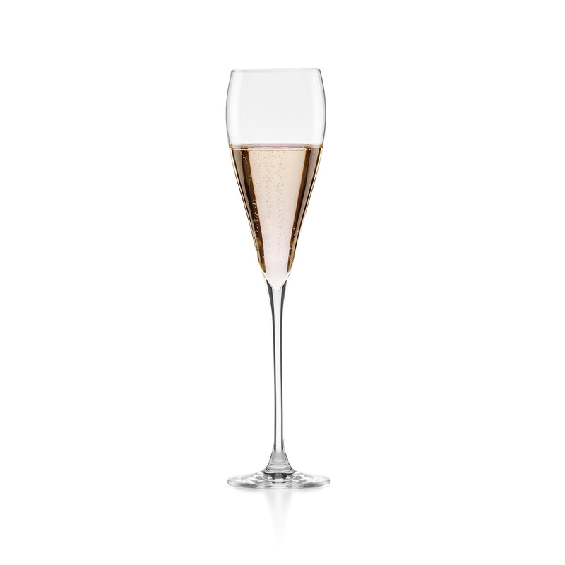Sparkling wine glass with gold-tone rim and faceted bowl, clear stem