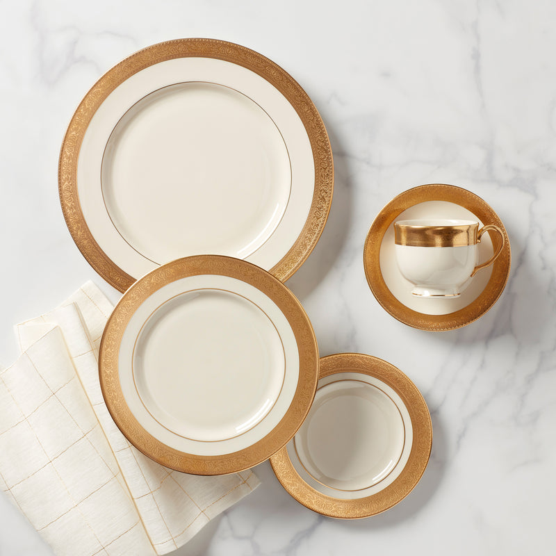 Lenox Westchester 5‑pc place setting: gold-rimmed plates and teacup with tan band.