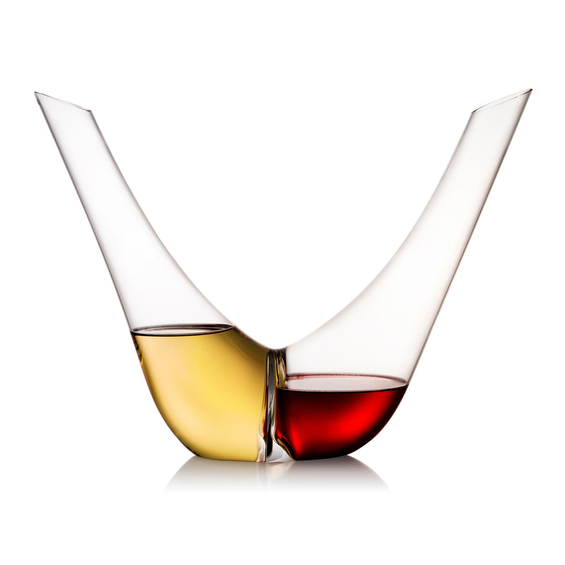 Crystal duo decanter with two faceted open cups, one amber-gold and one deep red.