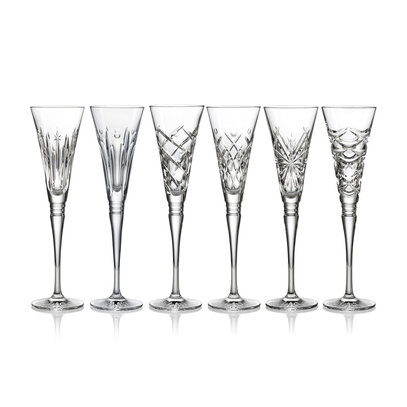 Set of six clear cut-crystal flute glasses with etched winter-style patterns