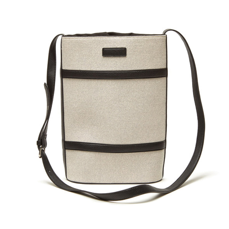 Double wine bag with beige canvas, black vegan leather trim, and adjustable crossbody strap.