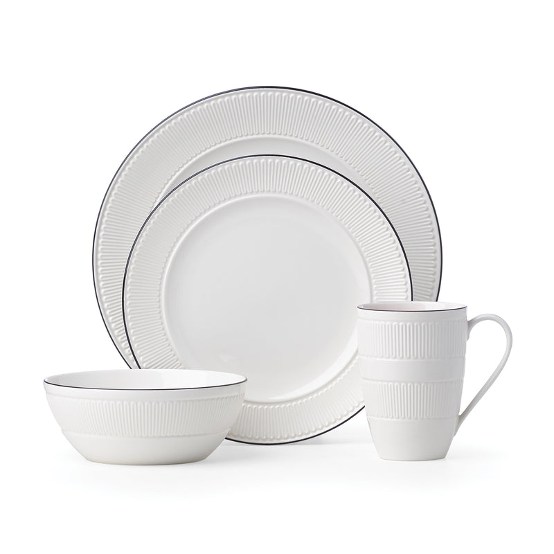 White ceramic 4-piece place setting with ribbed rim plate, bowl, and mug