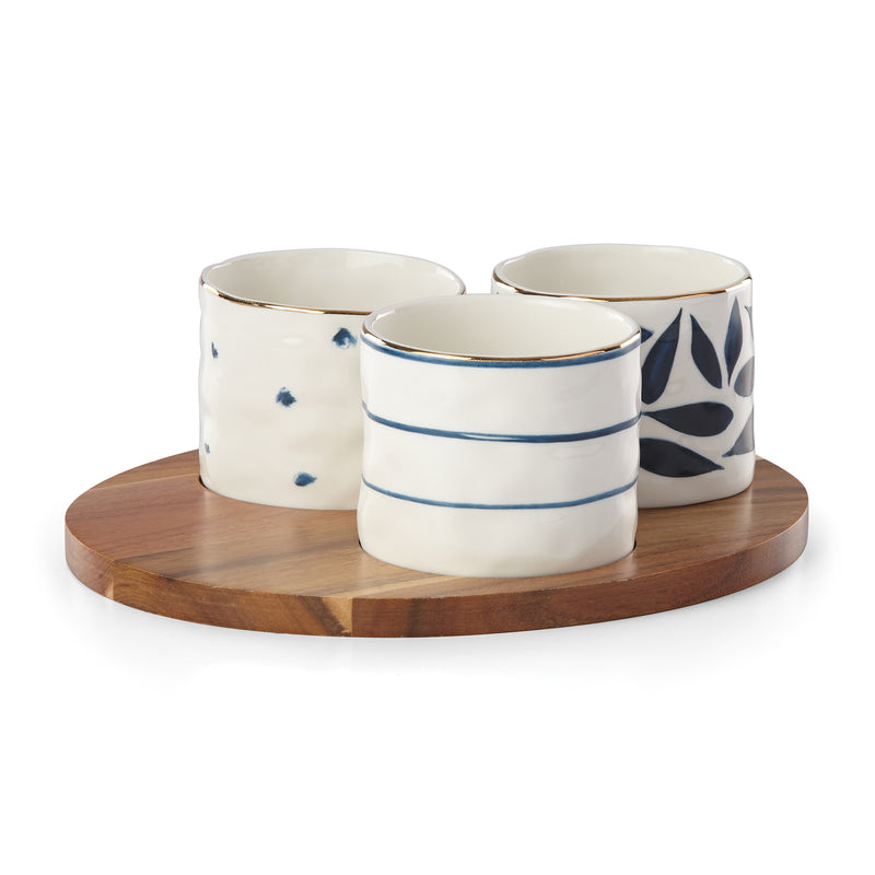 Set of 3 porcelain snack bowls with blue-and-black designs on a wooden tray