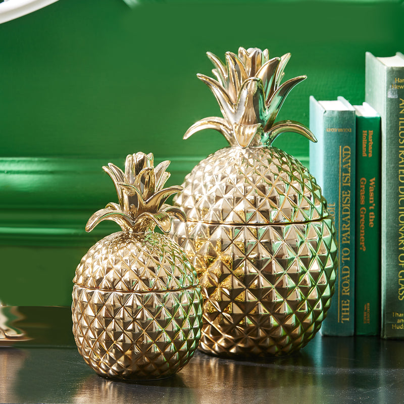 Pair of golden ceramic pineapple jars with embossed diamond texture lids