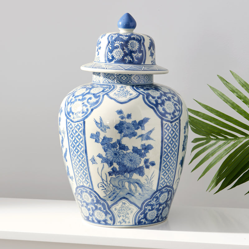 Blue and white porcelain temple jar with floral cartouche pattern and domed lid