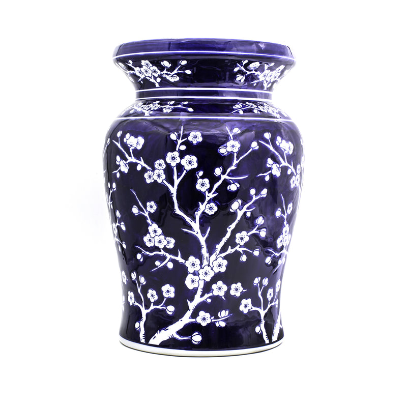 Porcelain garden stool with dark blue glaze and white cherry blossom branch design