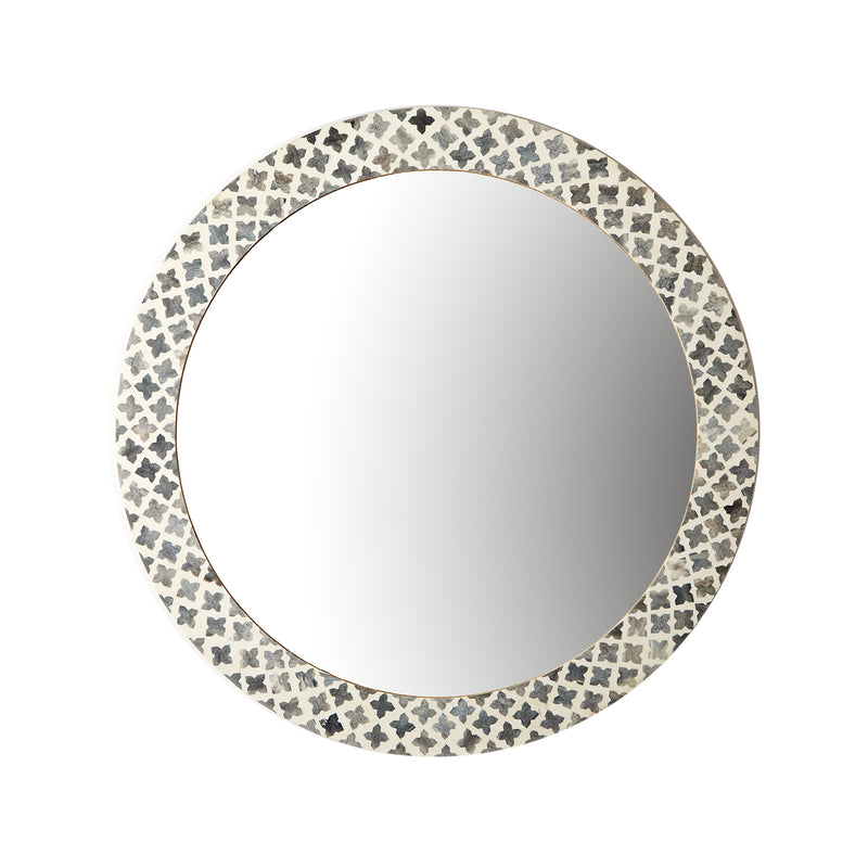 Round wall mirror with gray quatrefoil patterned frame and reflective glass