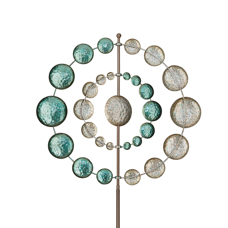 Vertical metal outdoor wind spinner with teal and gold disc orbit on pole