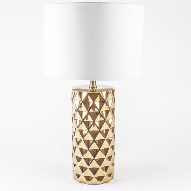 Gold studded glass table lamp with white drum shade