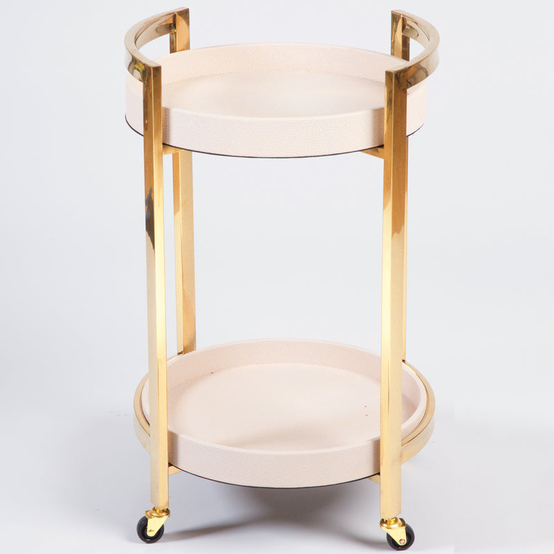 Blush pink and gold round bar cart with two tier shelves and four caster wheels