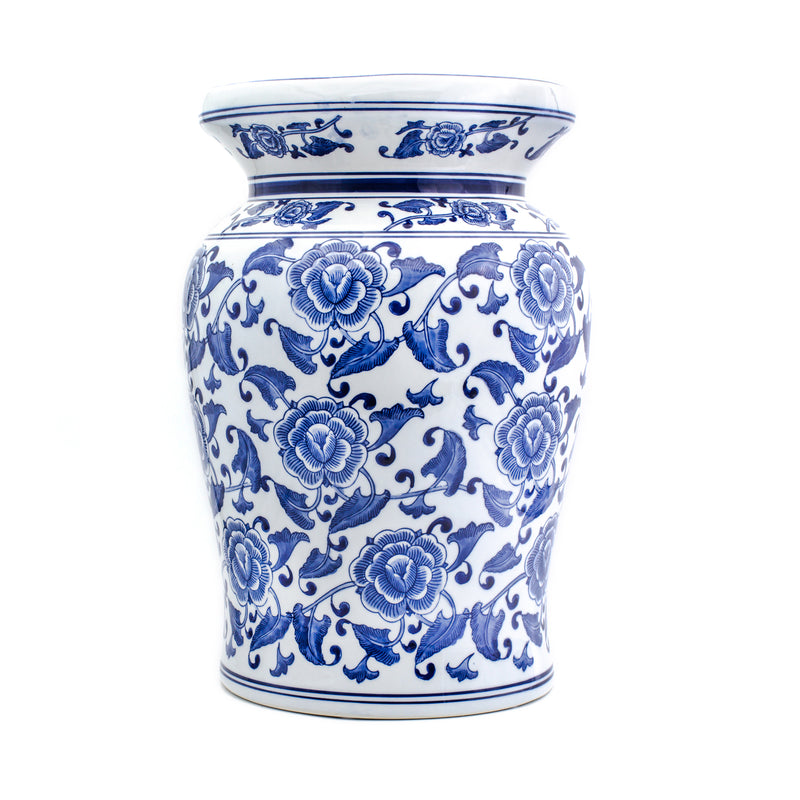 Blue-and-white ceramic garden stool with ornate floral relief pattern