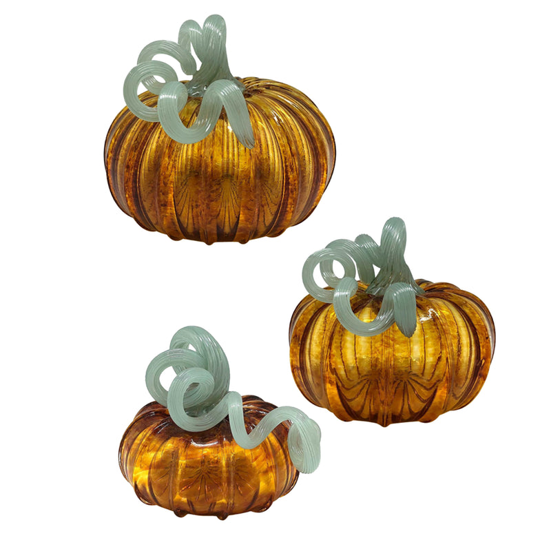 Amber glass pumpkin set with ribbed texture and teal swirl stems