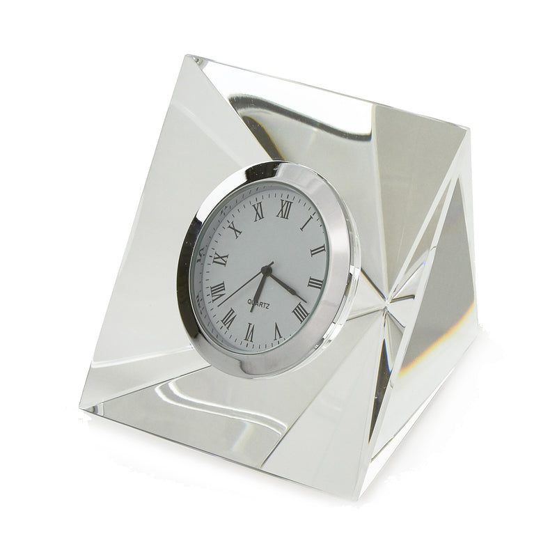 Crystal glass desk clock with round face, Roman numerals, and metallic frame
