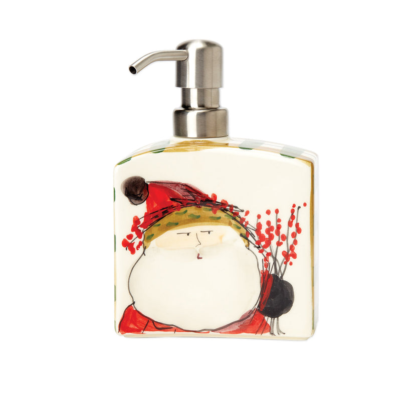 Decorative soap dispenser with metal pump and red Santa-style artwork on glass bottle