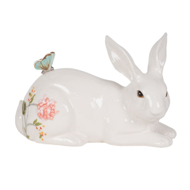 White resting rabbit figurine with floral and butterfly accents