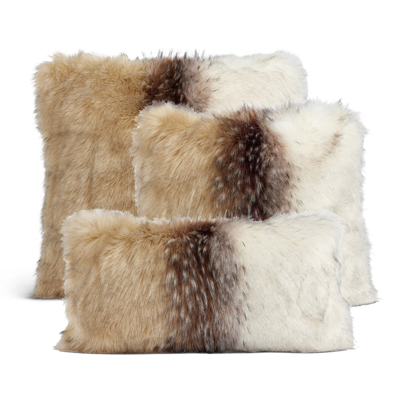 Patchwork faux fur throw pillow with cream, tan, and dark brown panels, plush surface