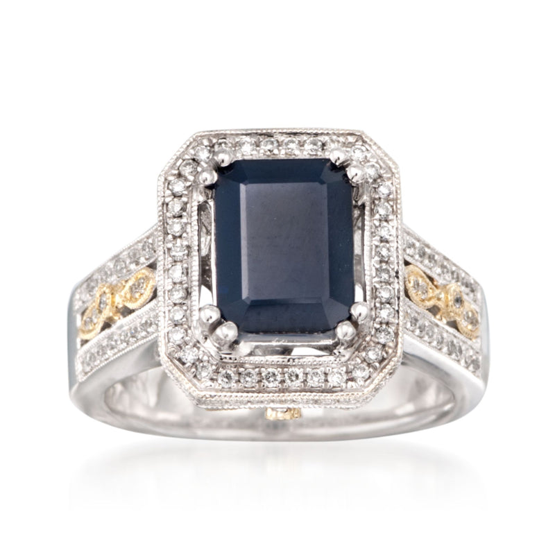 Two-tone gold ring with dark blue square sapphire center and diamond halo and side accents