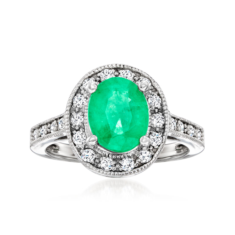 Oval green gemstone halo ring in 14kt white gold with diamonds