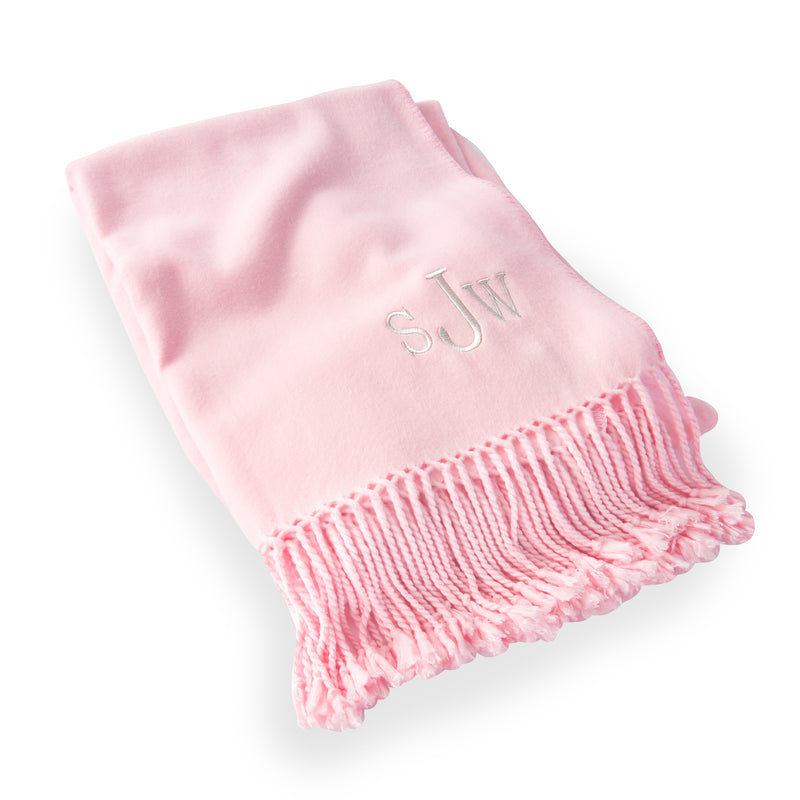 Pink ultra-soft throw blanket with embroidered monogram and fringed edge