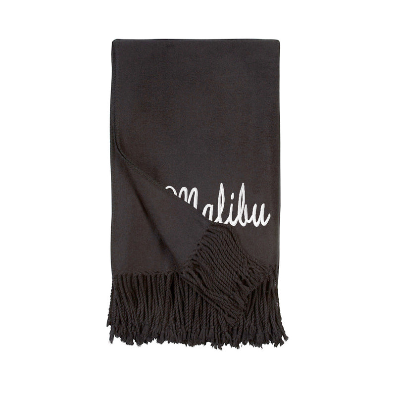 Black throw blanket with white Malibu script and black fringe edges