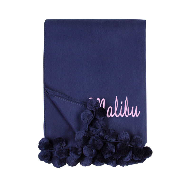 Indigo throw blanket with pom pom fringe and embroidered script name