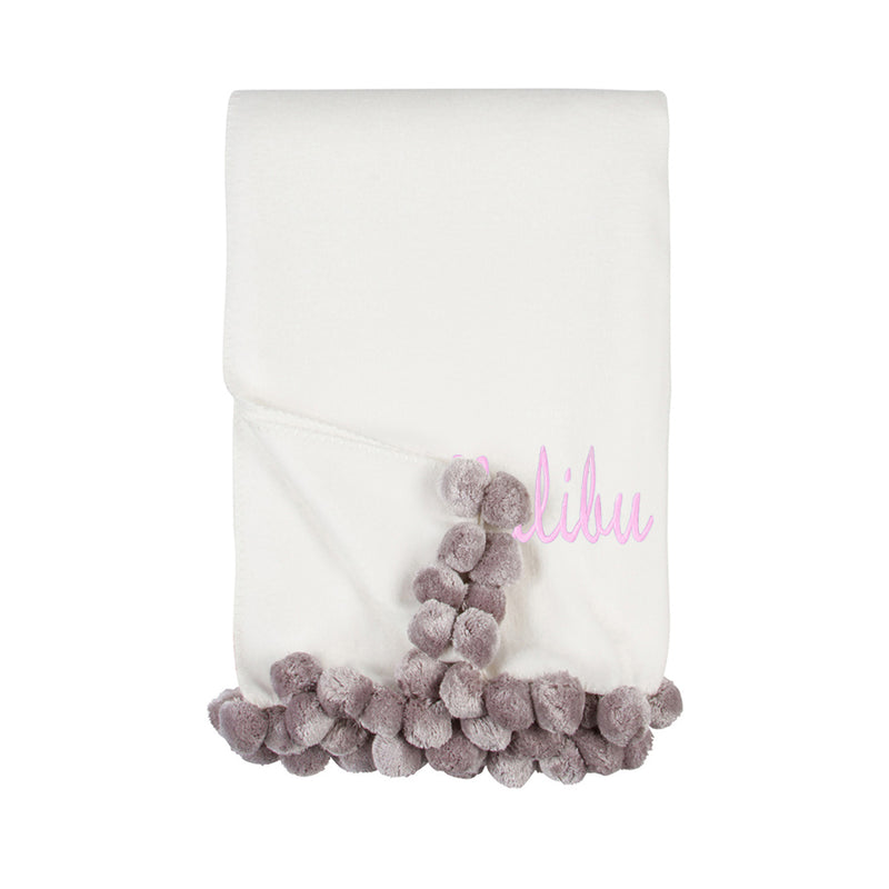 Ivory throw blanket with dove gray pom pom border and cursive name text