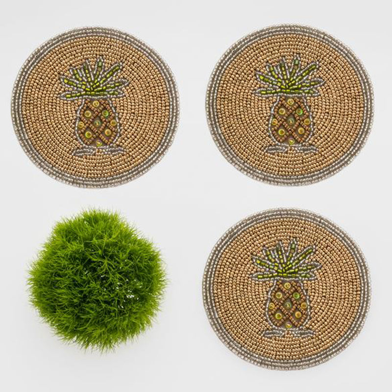 Round beaded coasters with colorful pineapple designs