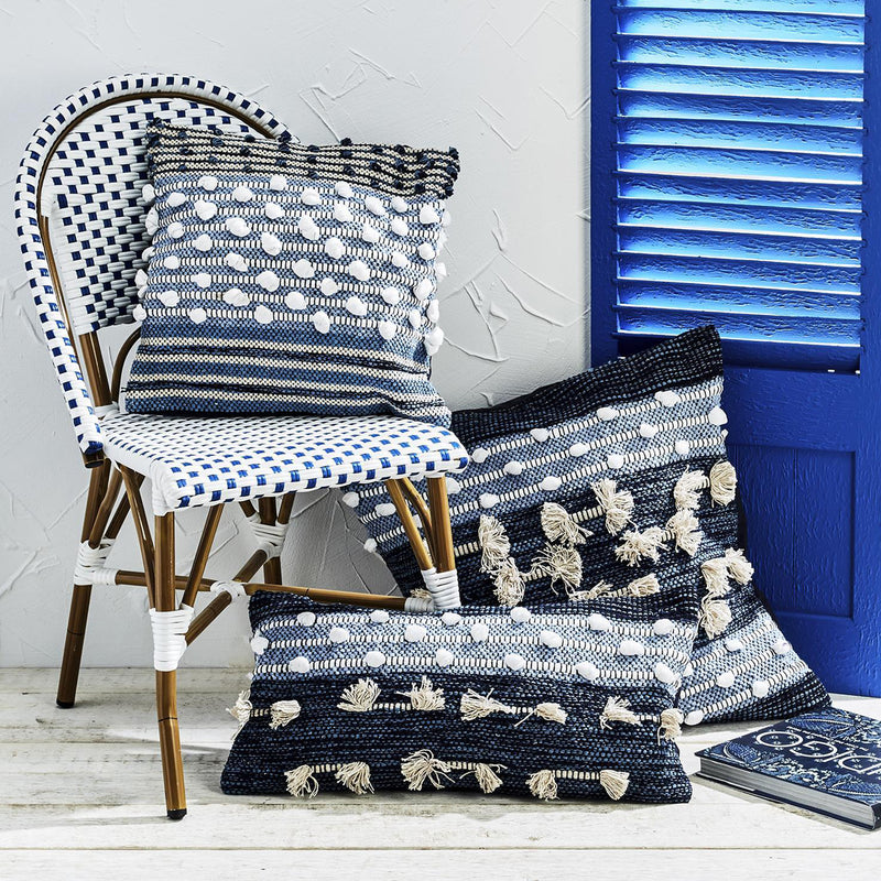 Set of three Atlantis handloom throw pillows with navy stripes, cream dots, and tassel fringe.