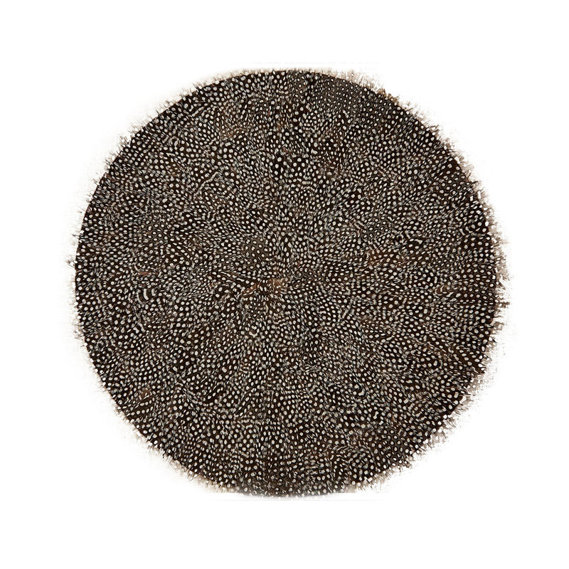 Round dark feather placemat with dense speckled pattern and stitched border