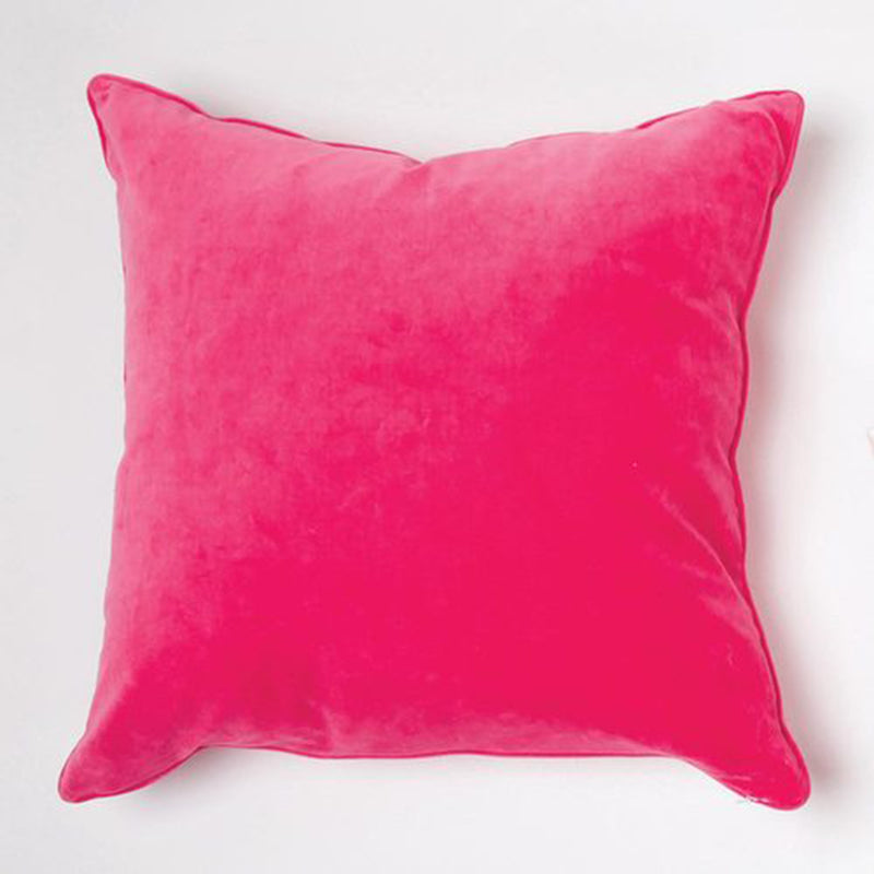 Pink velvet throw pillow with smooth fabric and square edges