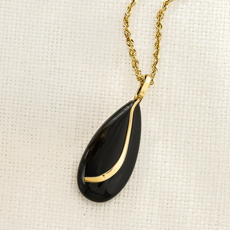 Onyx teardrop pendant in 14kt yellow gold with black cabochon on chain