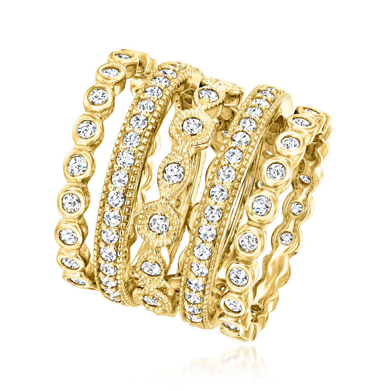 Five gold-tone CZ eternity rings with round clear stones, stacked side view