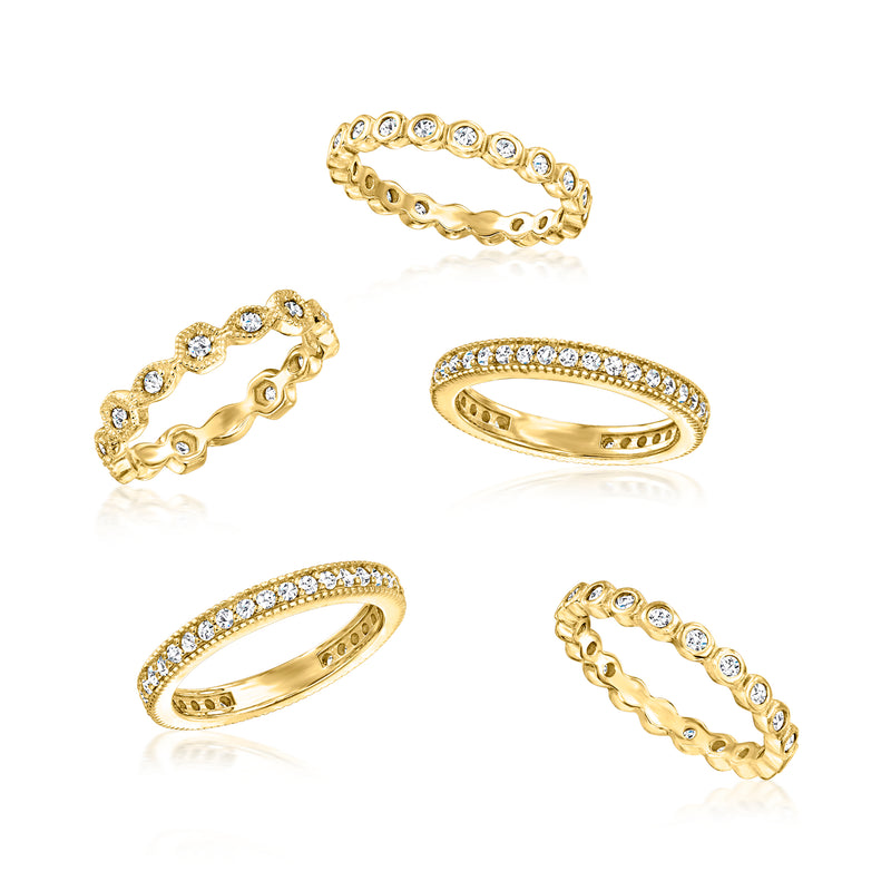 Set of five gold-tone CZ eternity rings with round clear stones across the bands