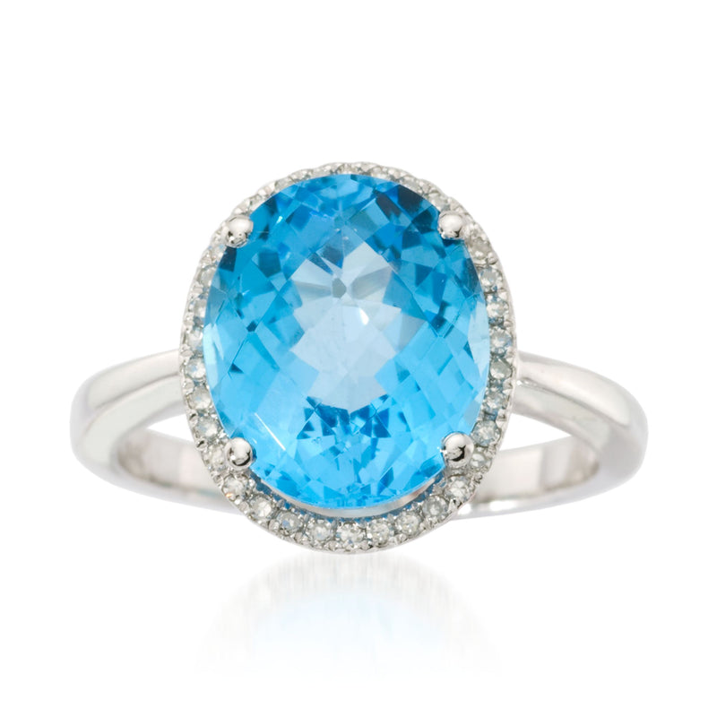 14k white gold ring with oval blue topaz, diamond halo, and small side diamonds