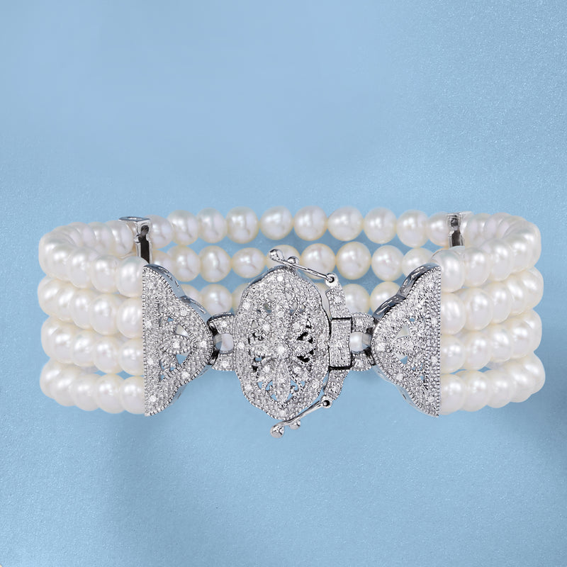Pearl and diamond multi-strand bracelet in sterling silver with ornate clasp