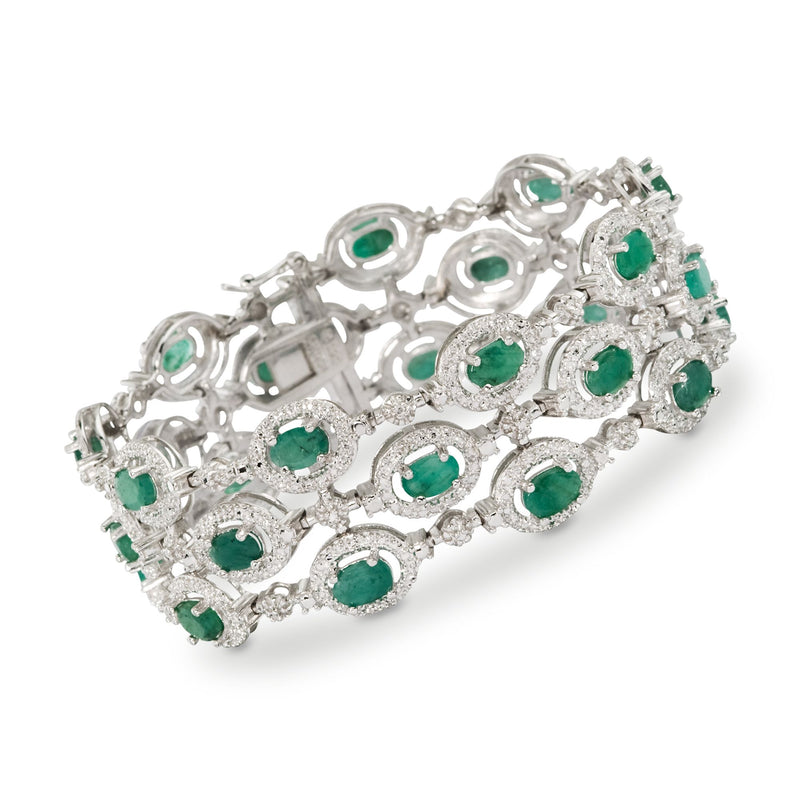 Sterling silver bracelet with three rows of oval green emerald stones and diamond accents