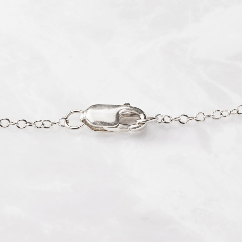 14kt white gold lobster clasp with chain and bezel-set diamond station links