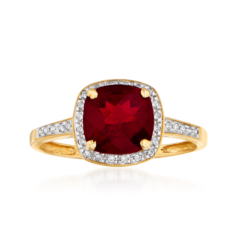 14kt yellow gold garnet and diamond ring with cushion-cut center stone and halo accents