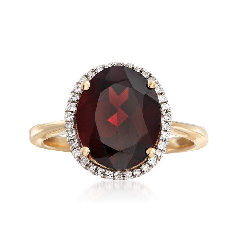 Oval garnet ring with diamond halo, oval dark red center, 14kt yellow gold band