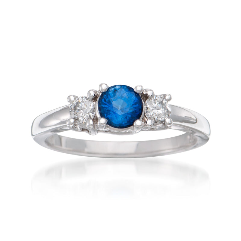 14kt white gold ring with oval blue sapphire center and three diamond side stones