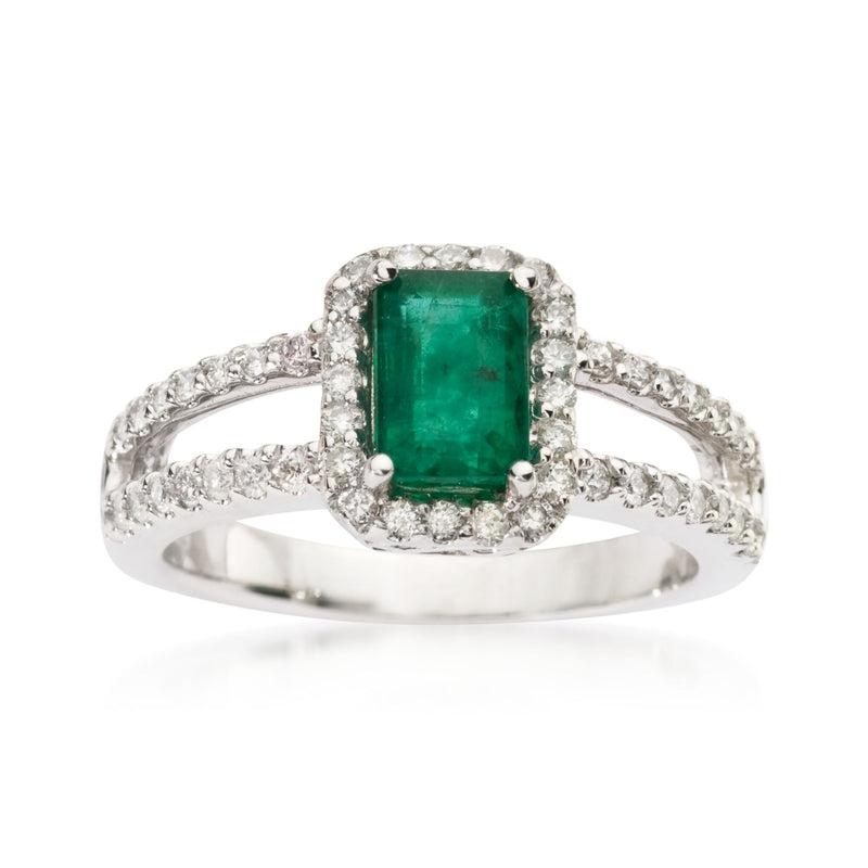 14kt white gold ring with emerald-cut emerald center and diamond halo, split shank