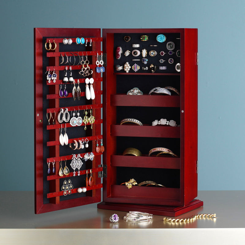 Spinning jewelry organizer cabinet with rotating ring trays, earring hooks, and necklace holders.