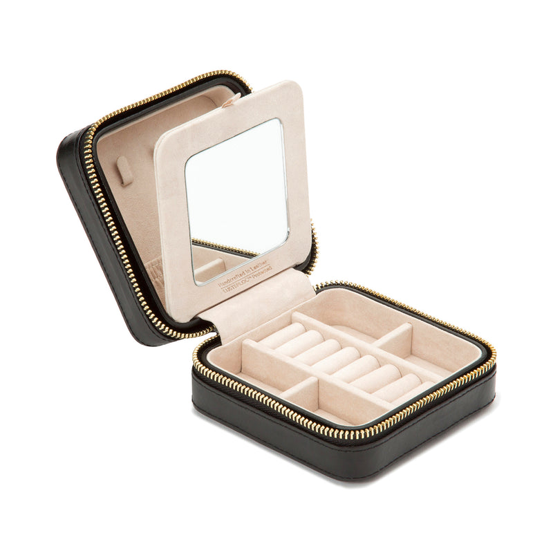 Black leather zip travel jewelry case with open compartments and small mirror