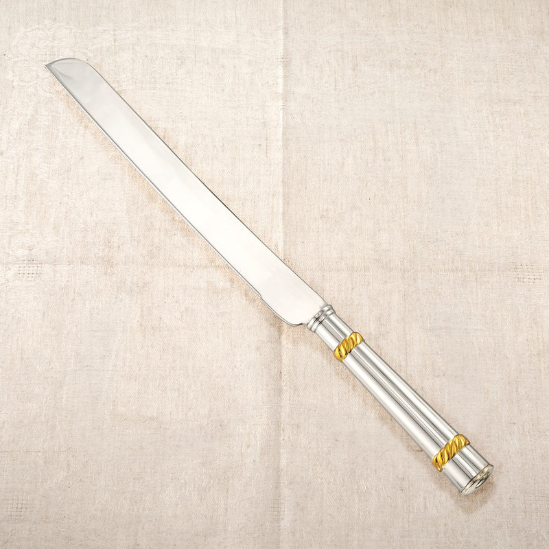 Two-tone challah knife with long silver blade and gold-toned handle rings