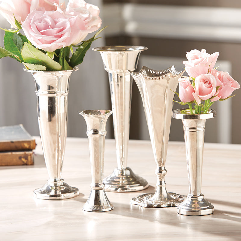 Set of five silver floral vases, assorted heights with fluted stems