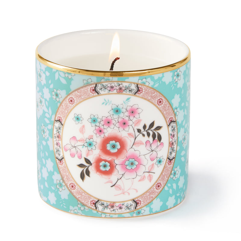 Wedgwood Wonderlust camellia floral candle jar with gold rim, lit wick